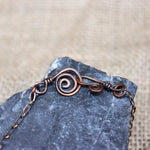 Copper raven pendant