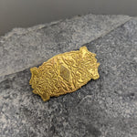 Brass brooch with four wolf design