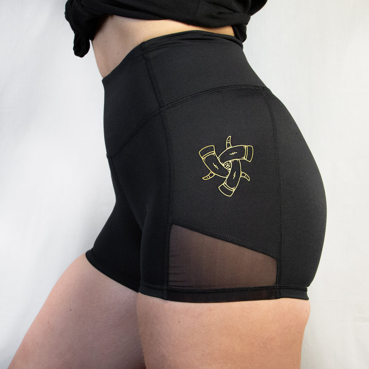 Women's Compression Shorts, Black performance gym shorts with gold detailing 
