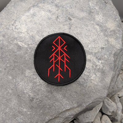 Black patch with embroidered red Horns of Odin bind rune 