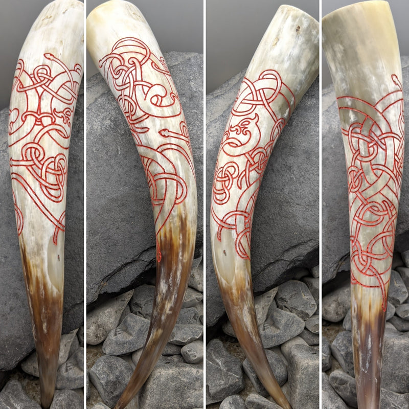 Hand drawn and carved red knot work horn